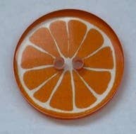 Kuvassa on appelsiinin näköinen hedelmänappi