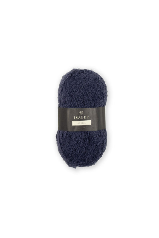 Kuvassa on Isager Bouclé -lankakerä (yarn) sävyssä 47.